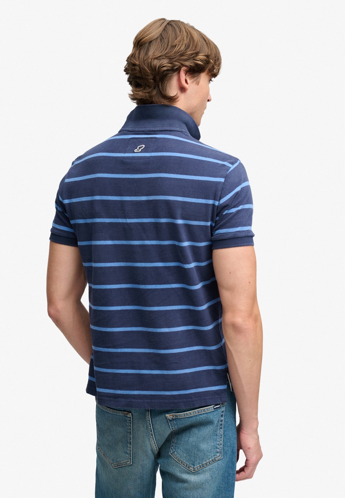 Superdry Vintage Stripe Jersey Polo in Navy Blue Stripe back view on model