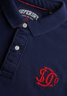 SUPERDRY Pique Monogram Polo-Darkest Navy/red Darkest Navy/Red flat front view