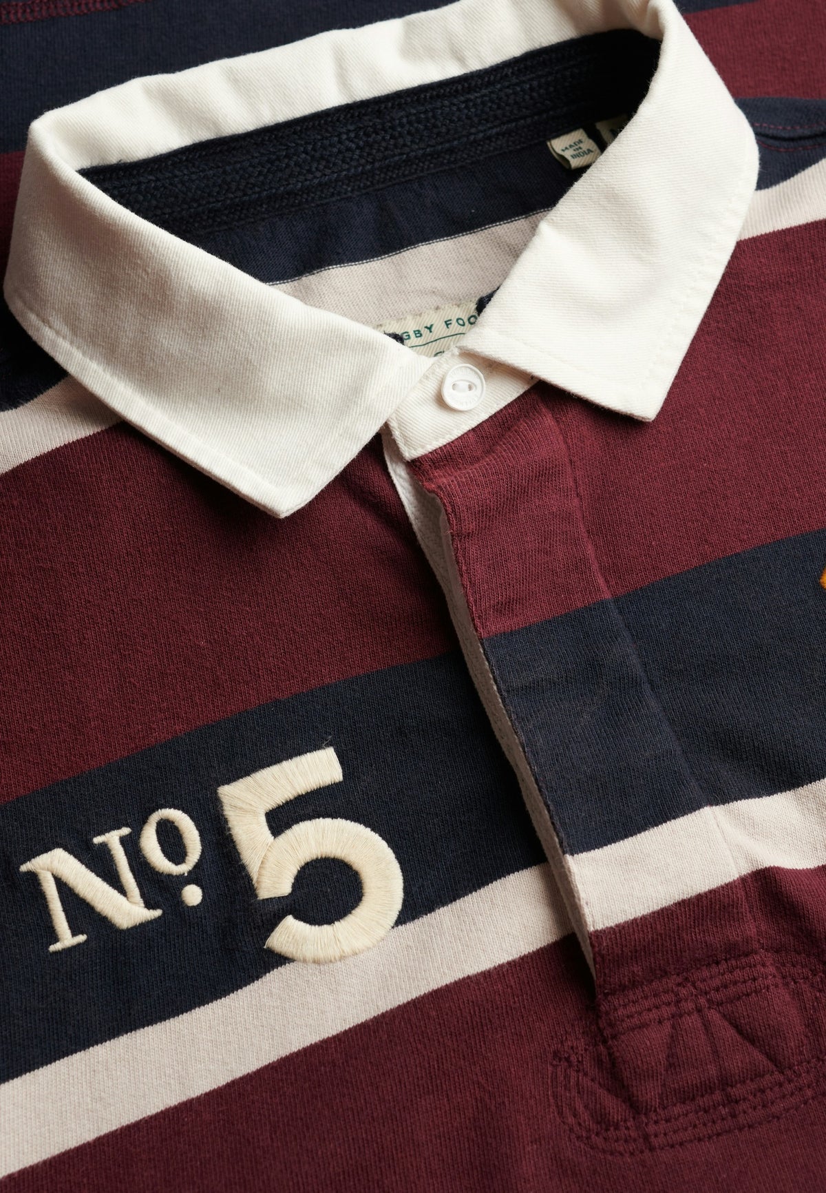 Superdry Double Emblem Stripe Rugby in Port/Navy Stripe collar and stripe detail