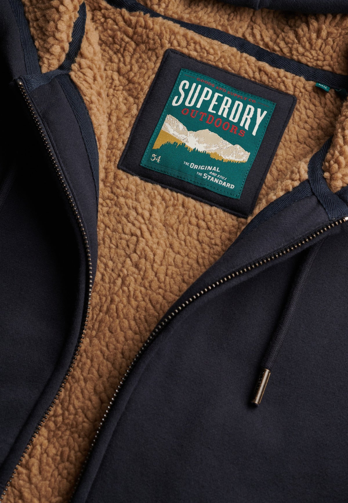 Superdry Borg Lined Ziphood in Eclipse Navy borg lining and logo patch detail