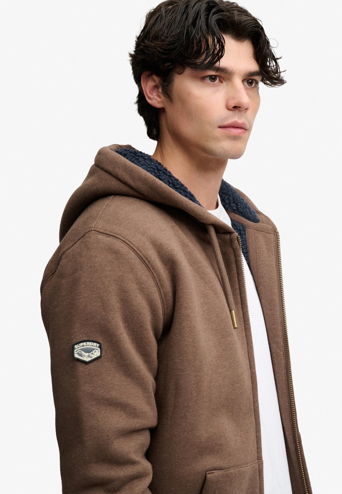 Superdry Borg Lined Ziphood in Mocha Brown Marl angled view on model