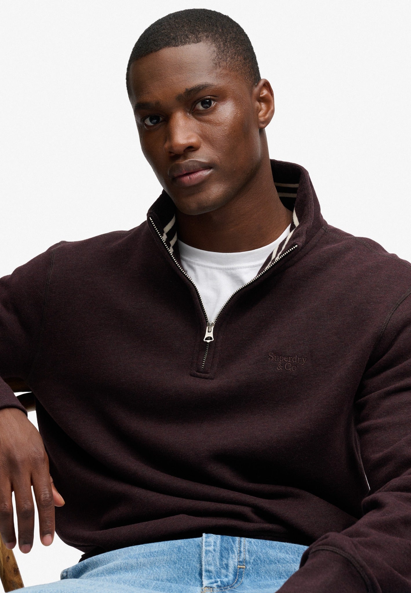 Superdry Essential Serif Logo Half Zip in Heritage Port Marl seated view