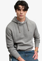 Superdry Essential Sdco Logo Hoodie in Dark Vintage Grey Marl seated model view