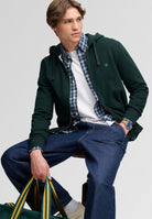 Superdry Essential Sdco Logo Ziphood in Heritage Dark Pine Green seated model view
