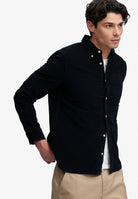 Superdry Classic Needle Cord Shirt in Rich Navy angled view on model