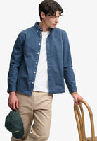 Superdry Garment Dyed Long Sleeve Shirt in Tumbled Slate Blue angled model view