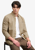 Superdry Garment Dyed Long Sleeve Shirt in Tumbled Tan seated view