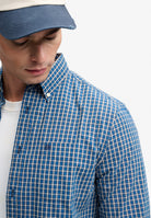 Superdry Preppy Poplin Long Sleeve Shirt in Glen Blue Check angled view on model