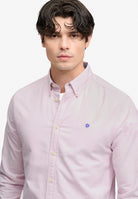 Superdry Preppy Oxford Long Sleeve Shirt in Blush Pink Chambray on model