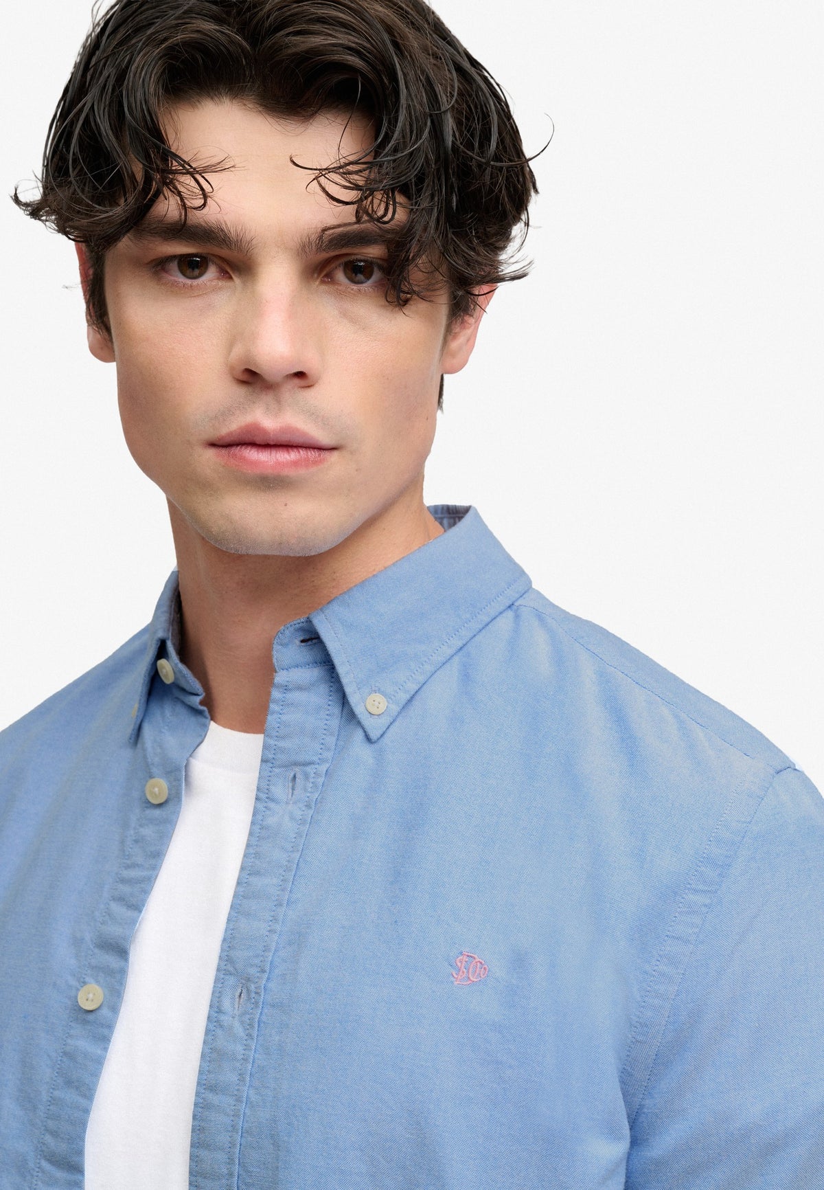Superdry Preppy Oxford Long Sleeve Shirt in Sky Blue Chambray angled view on model