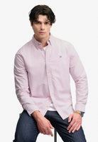 Superdry Preppy Oxford Long Sleeve Shirt in Blush Pink Chambray seated view
