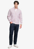 Superdry Preppy Oxford Long Sleeve Shirt in Blush Pink Chambray angled view on model