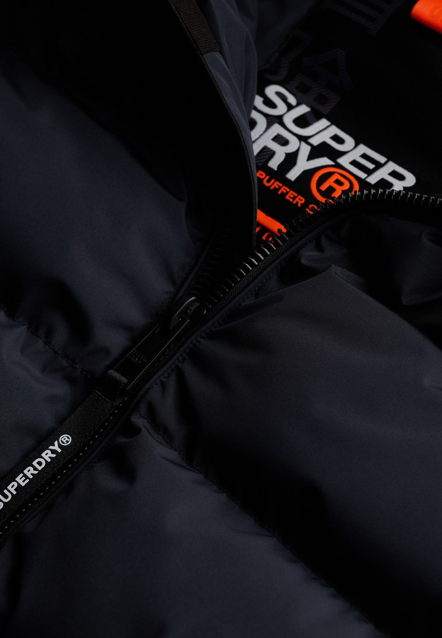 Superdry Hooded Sports Puffer Jacket - Eclipse Navy in Eclipse Navy/Eclipse Navy zip detail