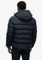 Superdry Hooded Sports Puffer Jacket - Eclipse Navy in Eclipse Navy/Eclipse Navy back model view