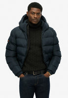 Superdry Hooded Sports Puffer Jacket - Eclipse Navy in Eclipse Navy/Eclipse Navy angled model view