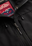Superdry Hooded Softshell Trekker Jacket in Black zip and logo detail