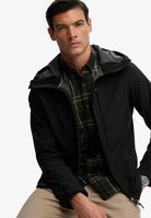 Superdry Hooded Softshell Trekker Jacket in Black seated model view