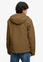 Superdry Hooded Softshell Trekker Jacket in Peak Sands Beige back view on model