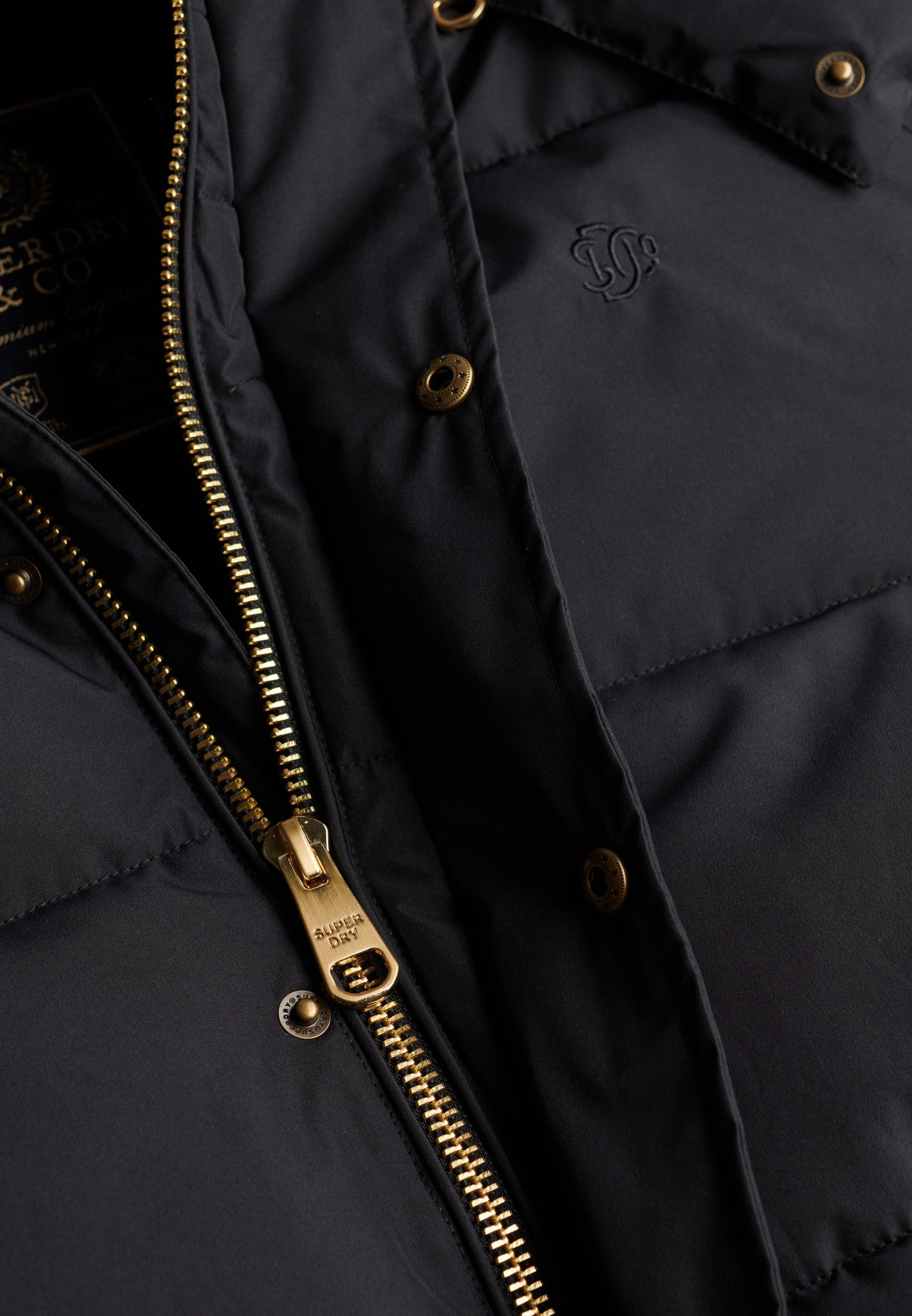 Superdry Premium Hood Puffer Jacket in Black zip and snap detail