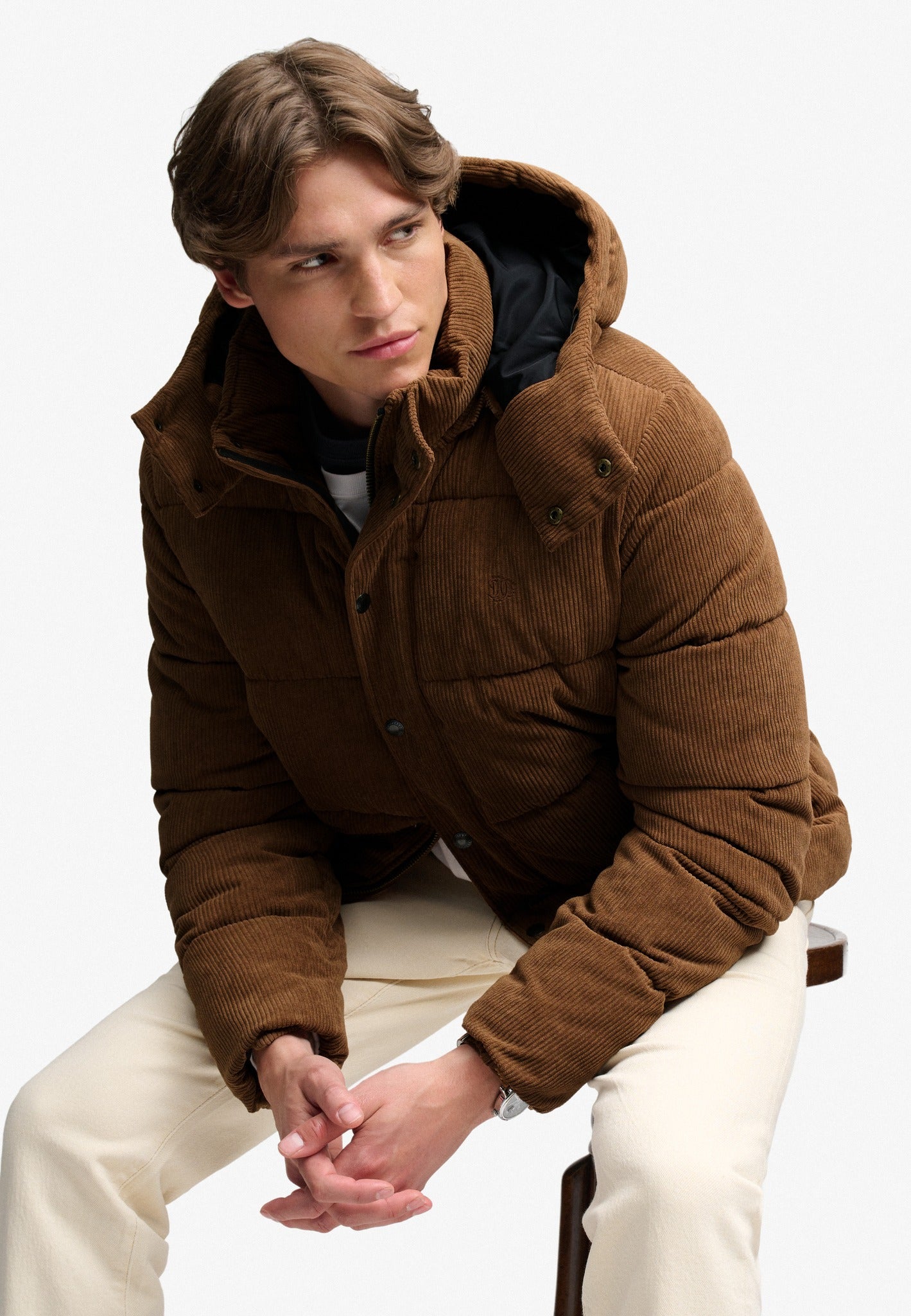 Superdry Premium Hood Cord Puffer Jacket in Dark Tobacco Brown seated view