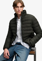 Superdry Fuji Midweight Padded Jacket in Surplus Goods Olive Green seated model view