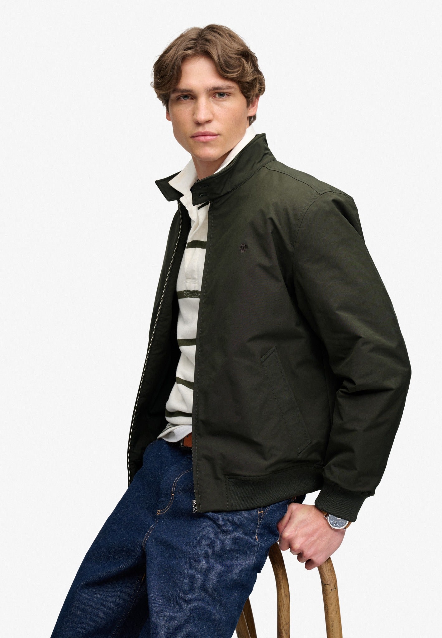 Superdry Campus Padded Harrington Jacket in Surplus Goods Olive Green seated model view