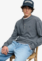 Superdry Mini Slub Waffle Grandad Top in Denim Blue Marl seated model view