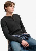 Superdry Waffle Long Sleeve Henley Top in Washed Black seated view