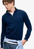 Superdry Prep Essential Cotton Half Zip in Pilot Blue Marl angled view on model