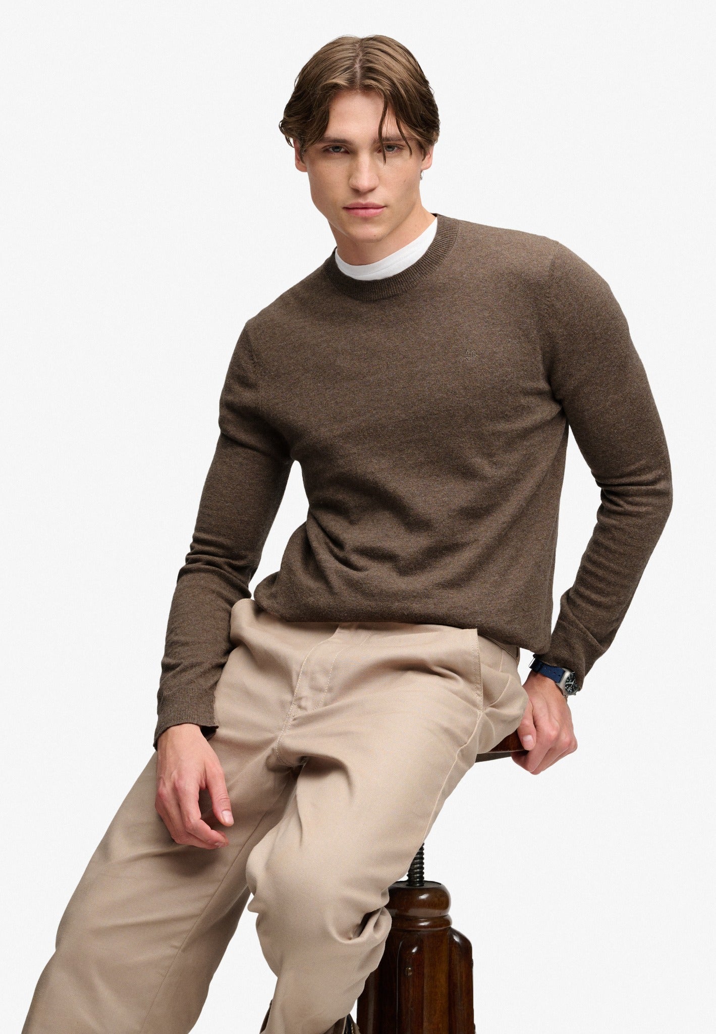 Superdry Essential Lightweight Wool Blend Jumper in Biscuit Brown Marl seated model view