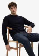Superdry Essential Lightweight Wool Blend Jumper in Deepest Navy seated view