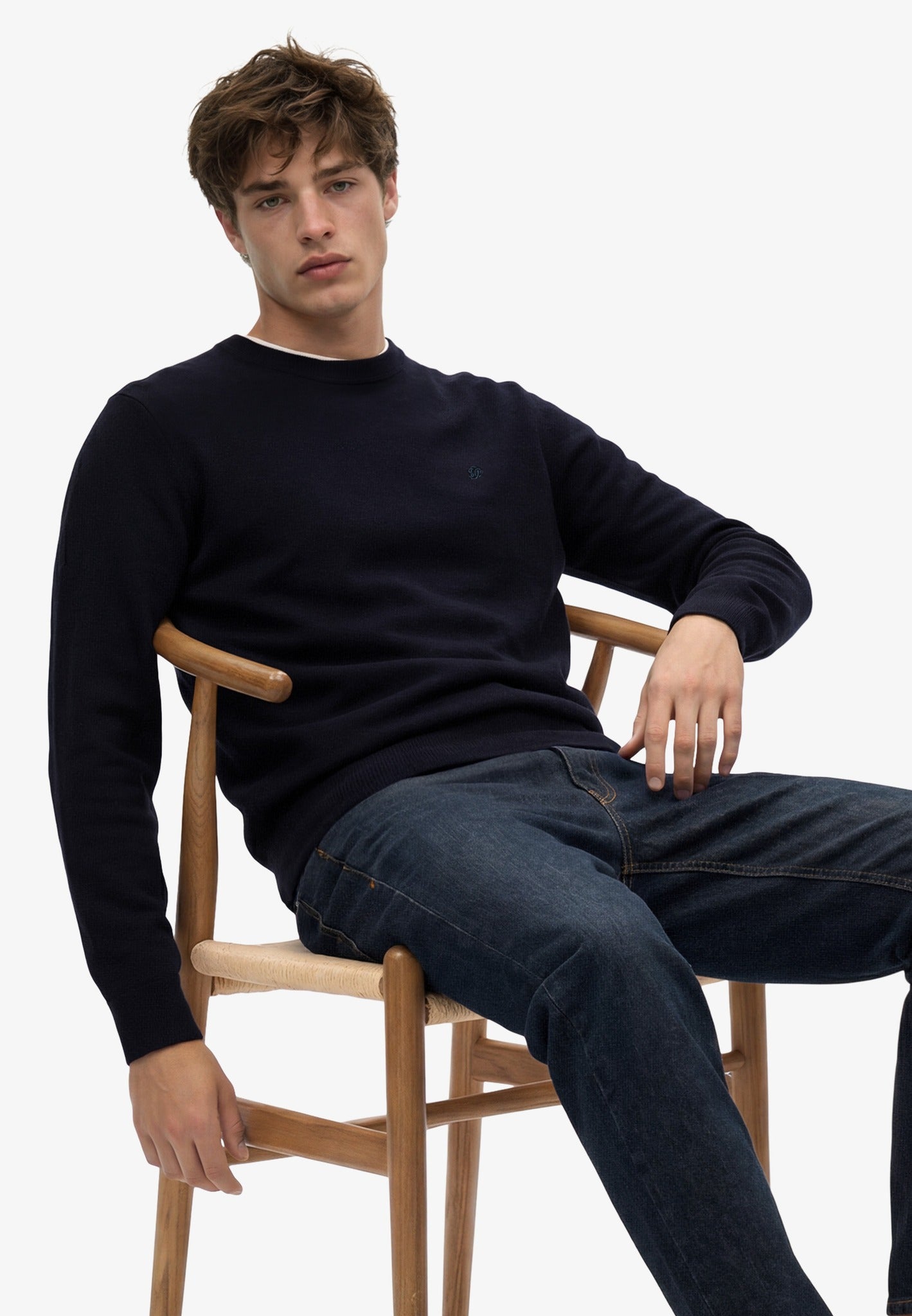 Superdry Essential Lightweight Wool Blend Jumper in Deepest Navy seated view