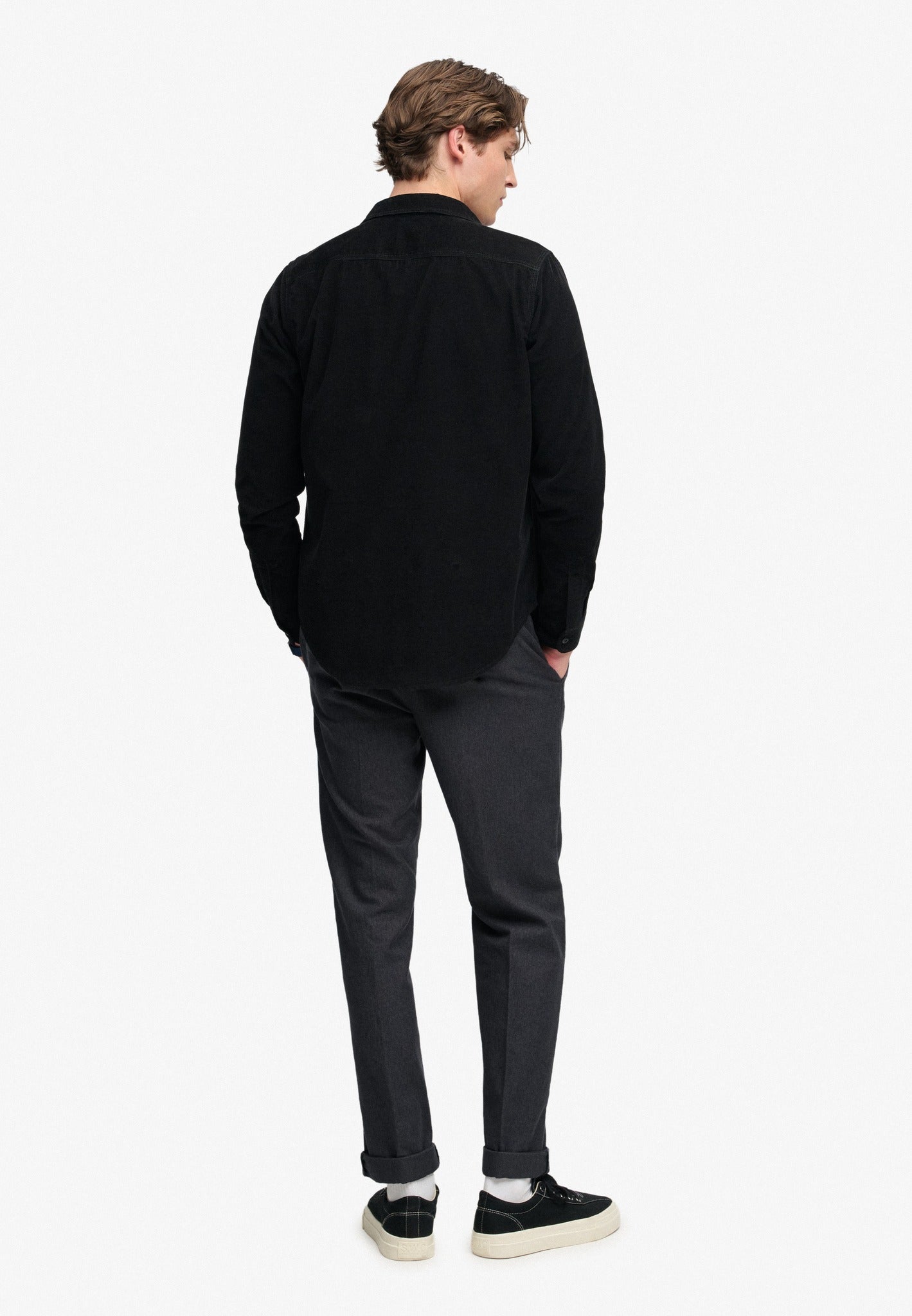 Superdry Premium Textured Regular Chino in Textured Charcoal angled view on model