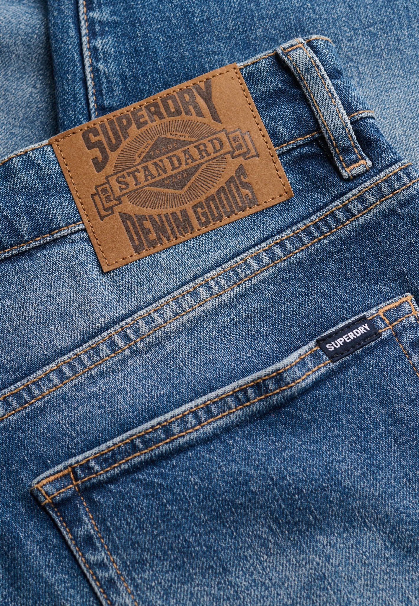 Superdry Vintage Tapered Jeans in Buck Blue logo patch detail