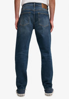 Superdry Vintage Tapered Jeans in Ranch Vintage Indigo back view on model