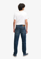 Superdry Vintage Tapered Jeans in Ranch Vintage Indigo angled view on model angled view