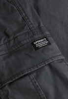 Superdry Regular Taper Cargo Trousers in Blackboard logo patch detail
