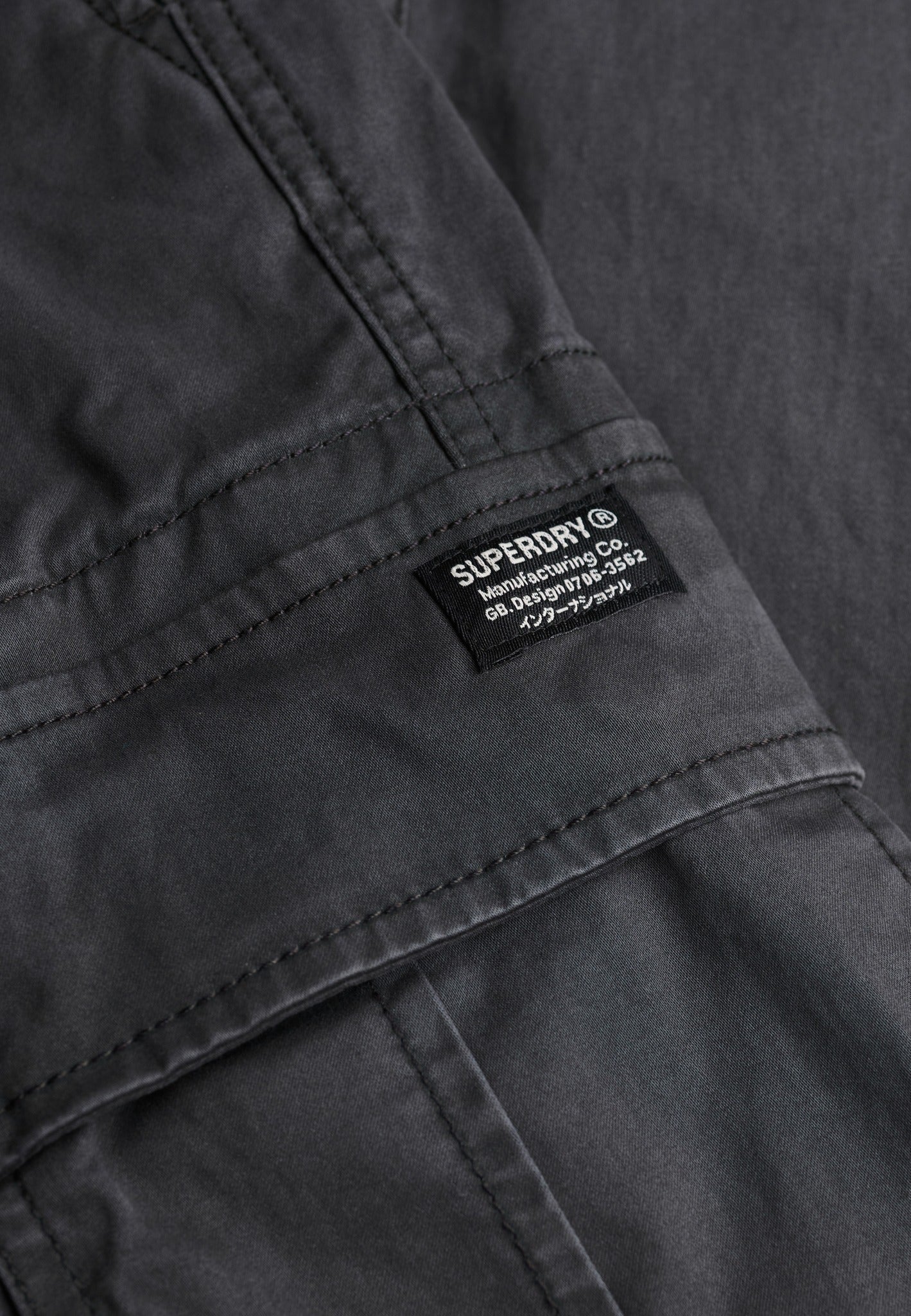 Superdry Regular Taper Cargo Trousers in Blackboard logo patch detail