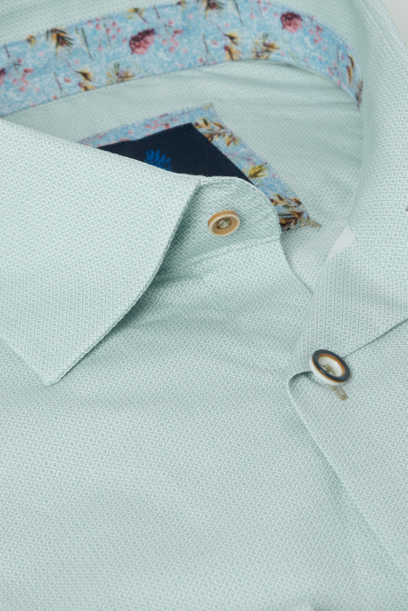 Light green shirt with floral collar and cuff details