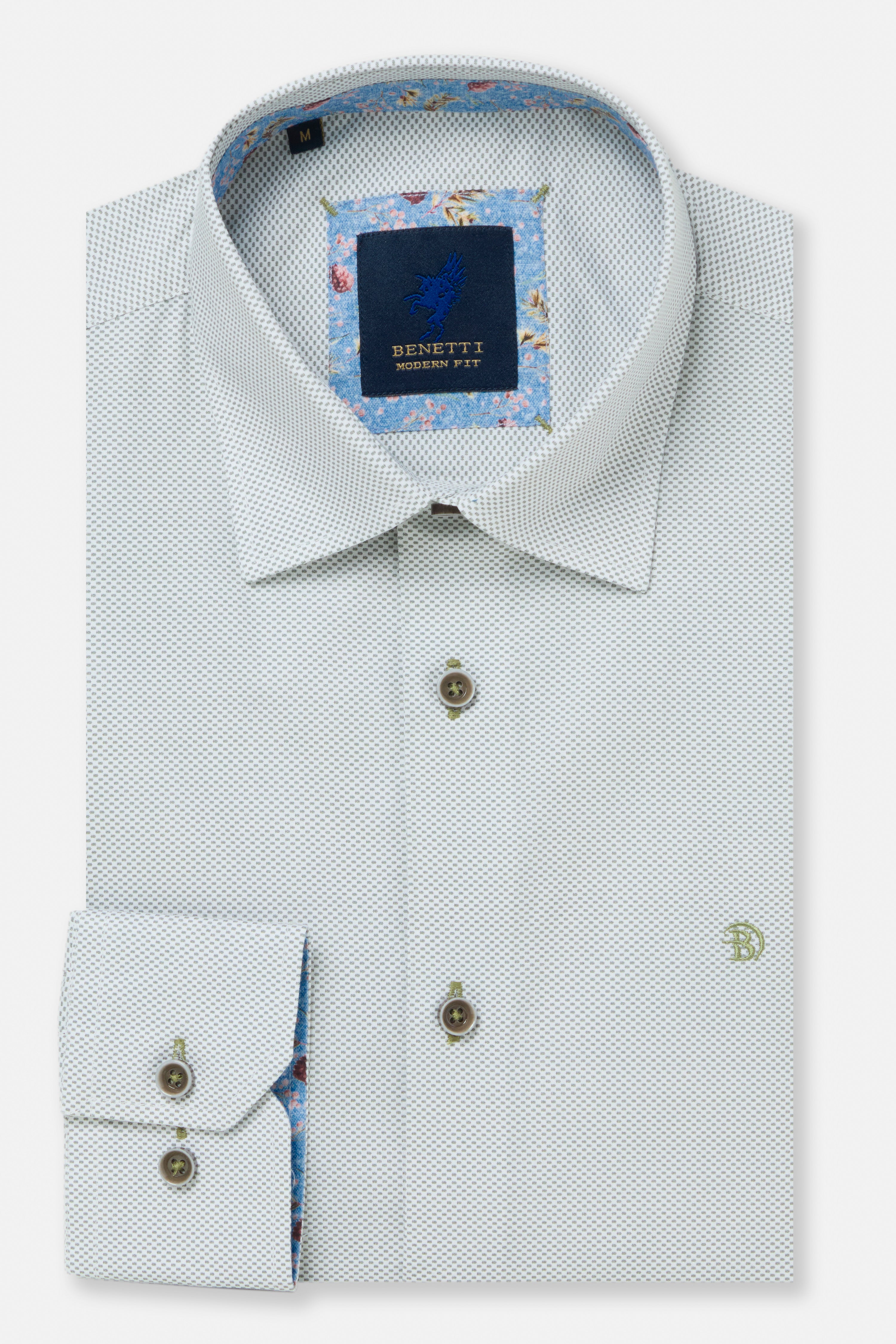 Folded sage green shirt with floral lining on a white background