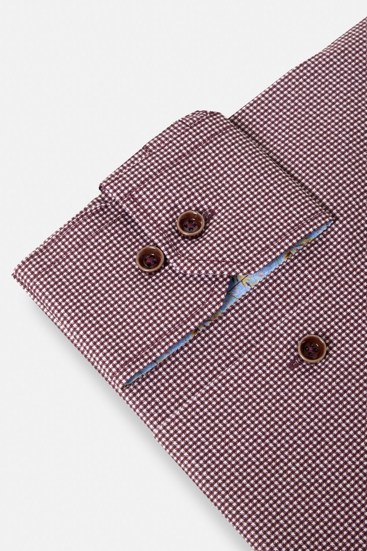 Benetti Riga Long Sleeve Plum Shirt cuff close-up with patterned plum fabric and brown buttons