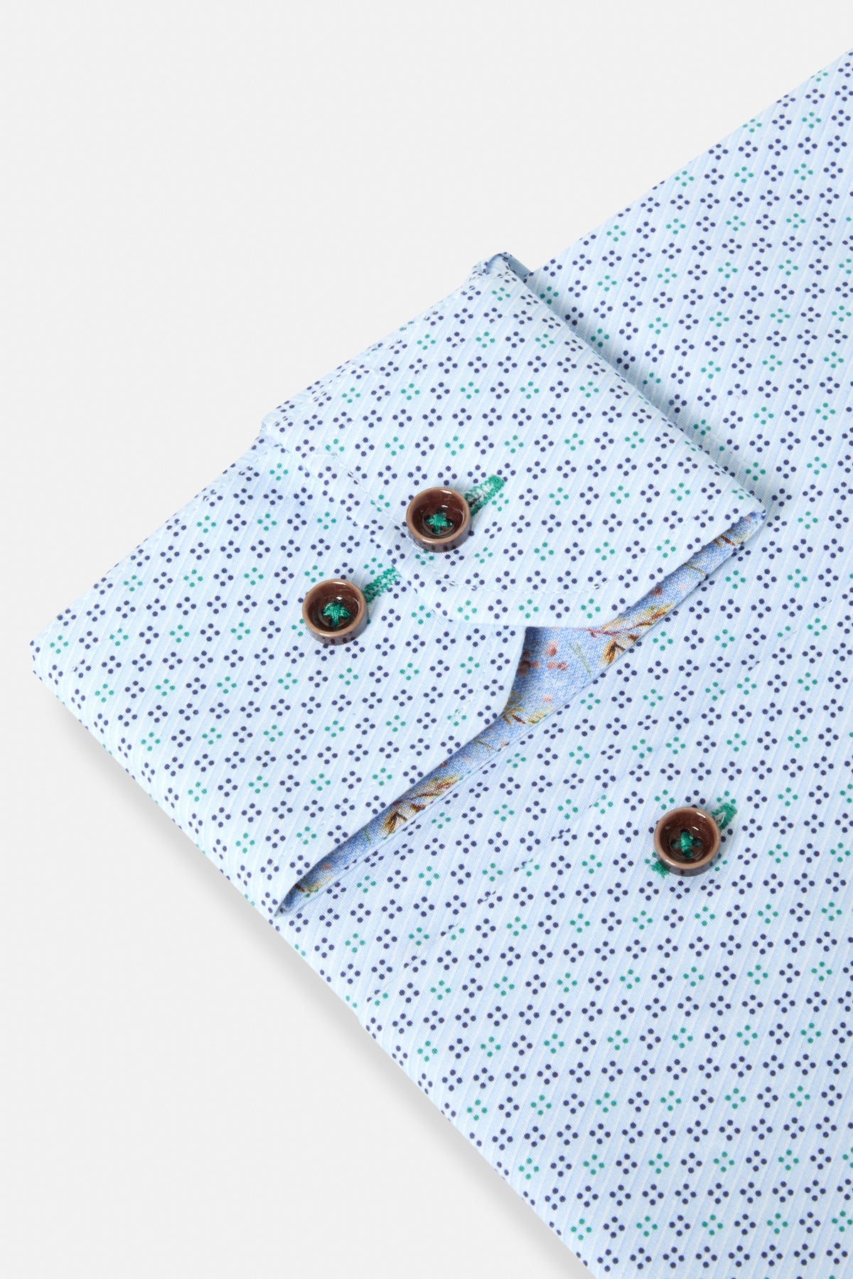 Benetti Tokyo Green Long Sleeve Shirt, close-up of cuff with patterned fabric, brown buttons, and green stitching detail.
