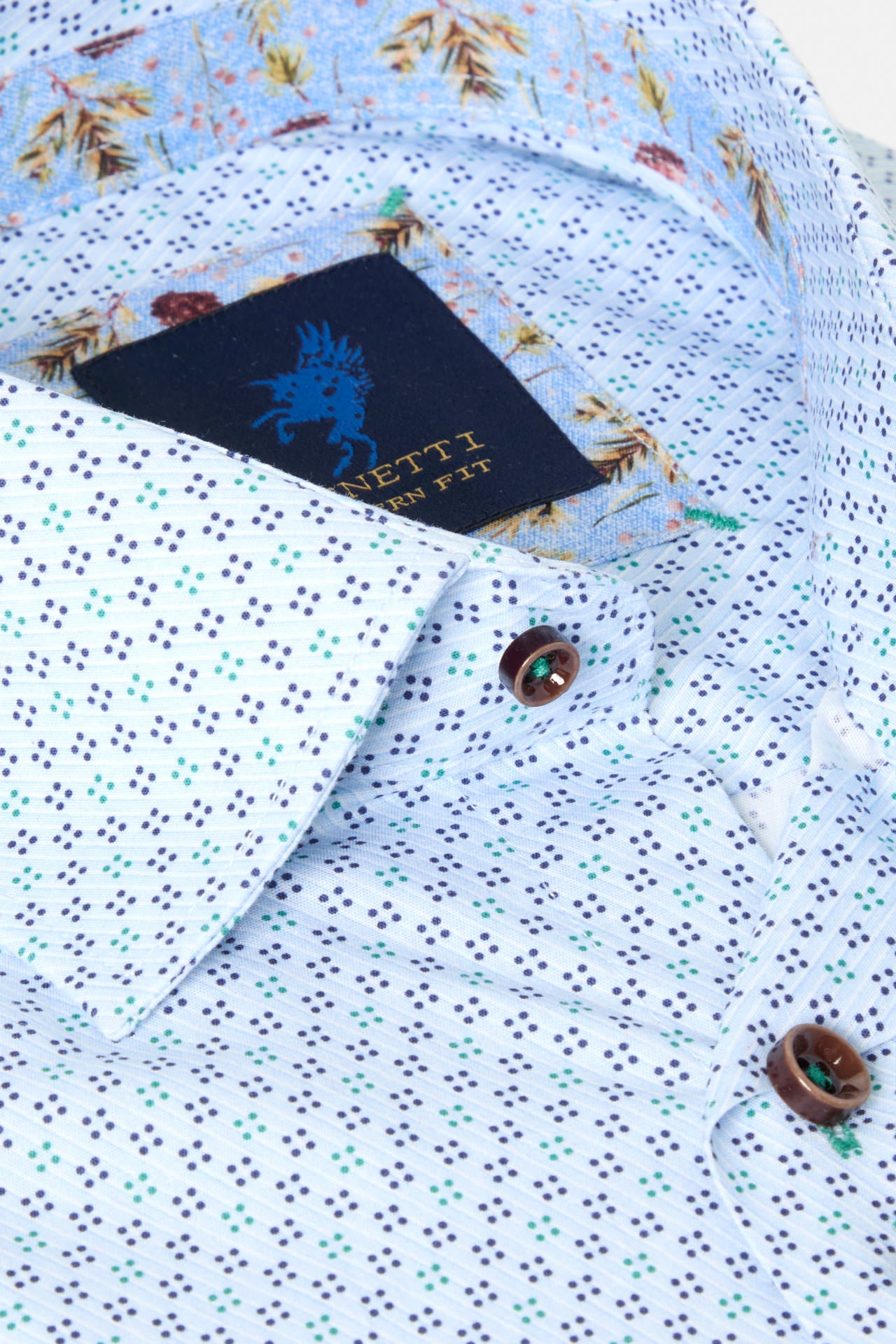 Close-up of a Benetti Tokyo Green Long Sleeve Shirt with a patterned button placket, brown buttons, and inner collar label visible.