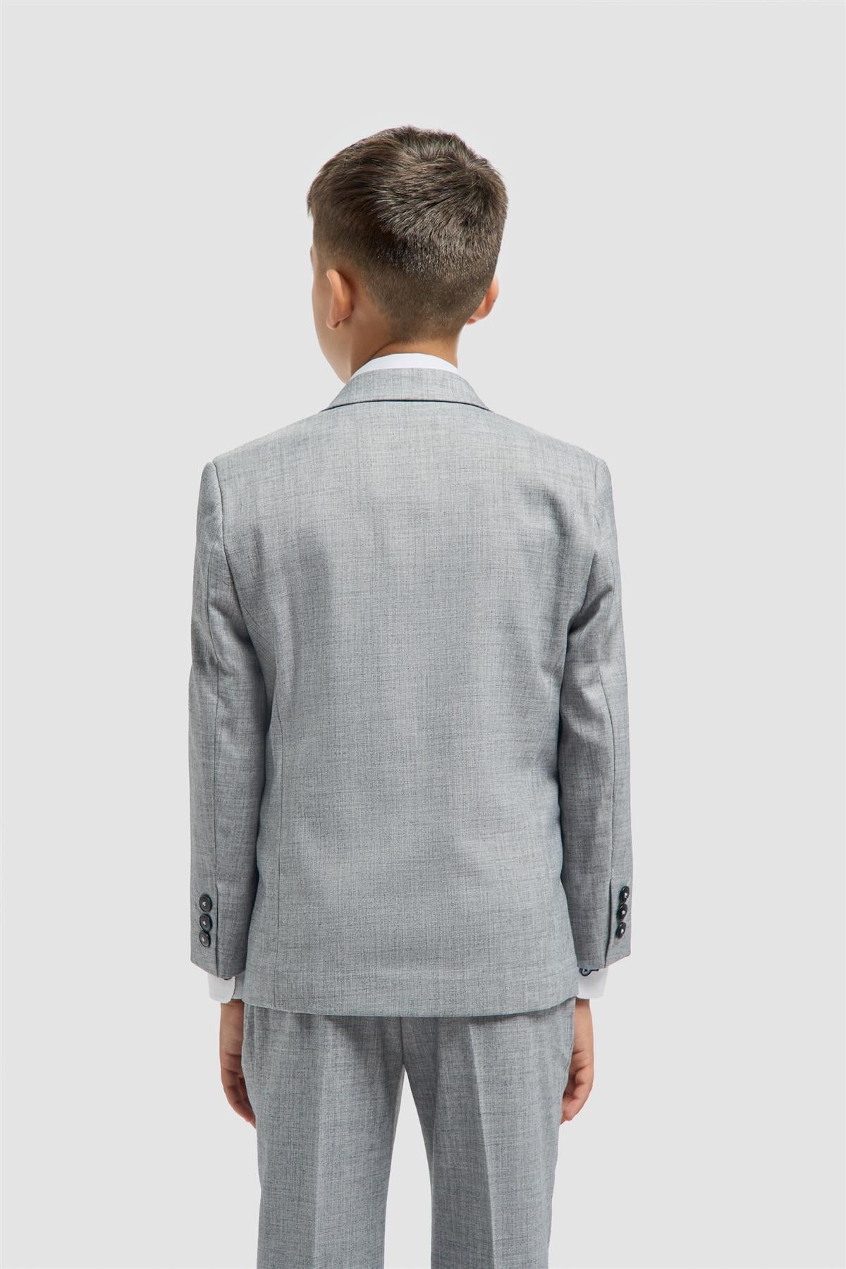 Boy wearing a gray textured suit on a white background