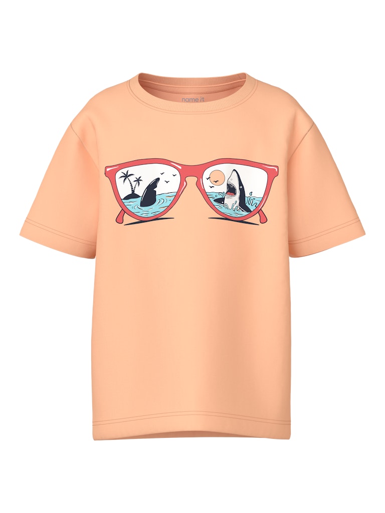Peach-colored t-shirt with sunglasses graphic on a white background