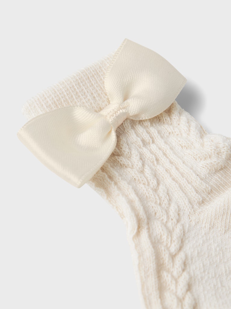 Rallie Sock-Summer Sand-Bow detail