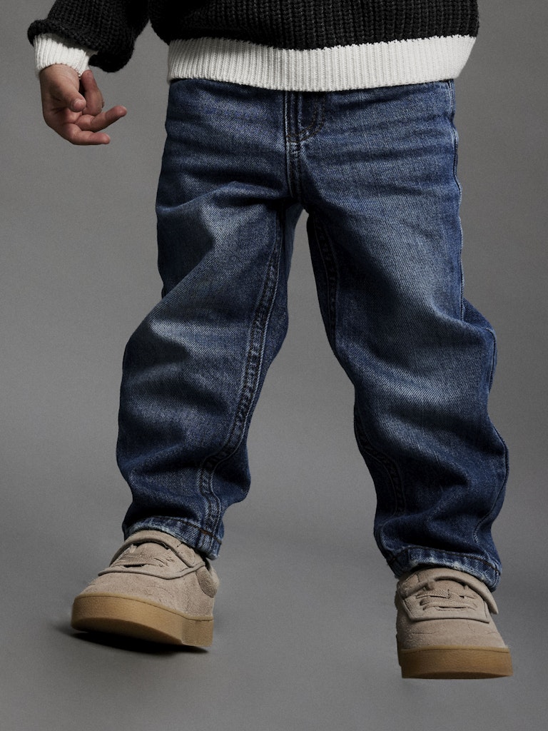 Silas Tapered Jeans-Medium Blue Denim-Model View