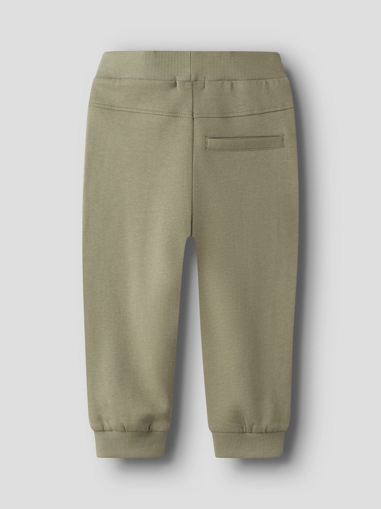 Green jogger pants on a light gray background