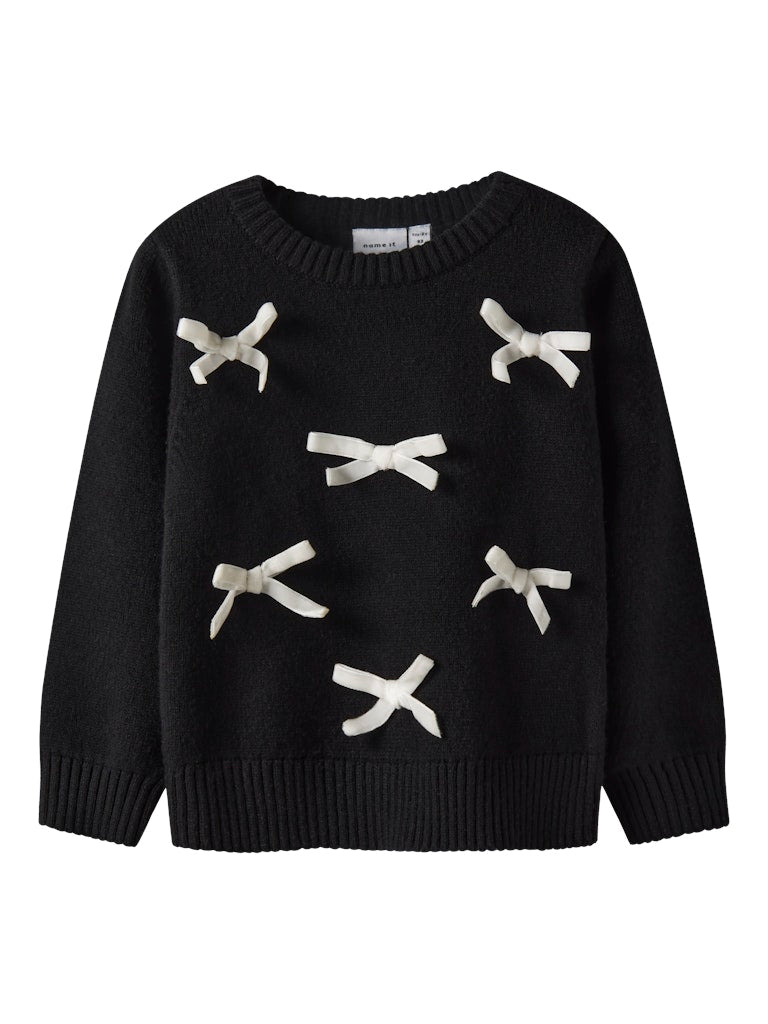 Black sweater with white bow designs on a white background