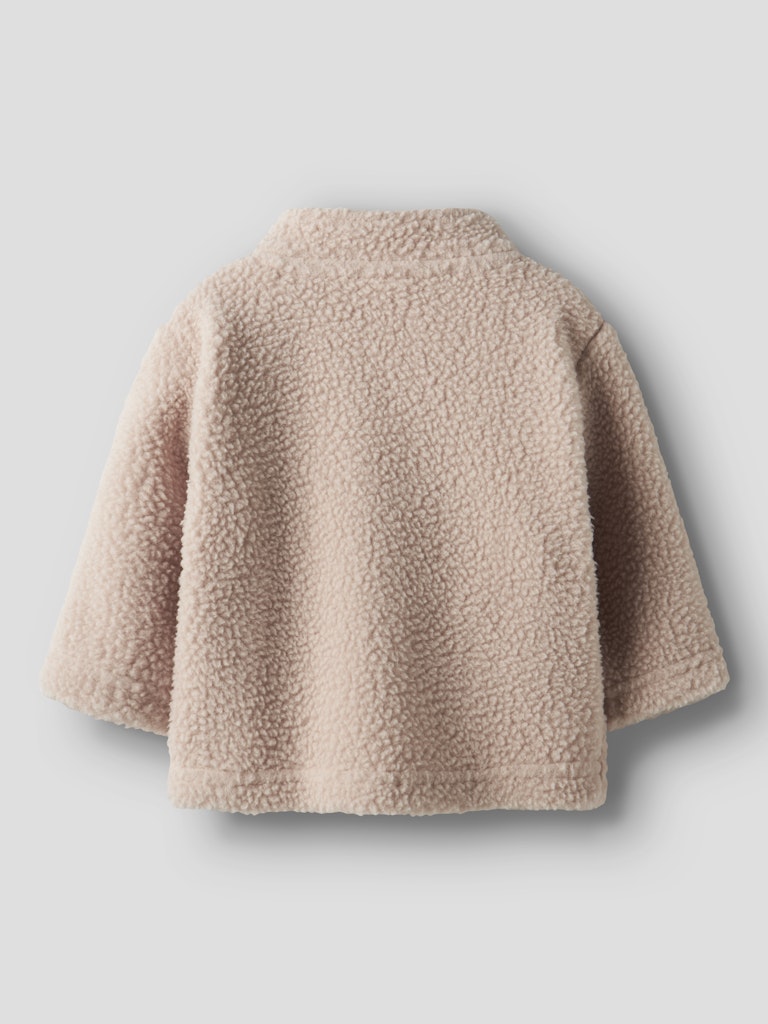Beige fleece jacket on a light gray background